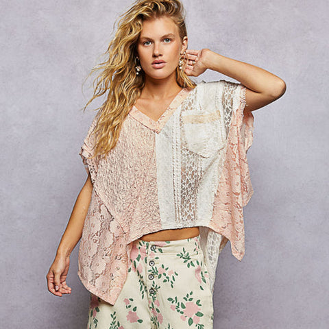 Woman wearing a floral outfit with a light background