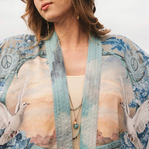 Woman wearing a floral kimono with a blurred background