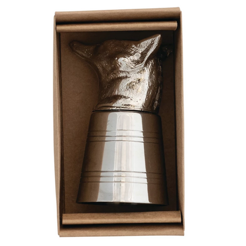 Silver deer-shaped object in a cardboard box on a white background