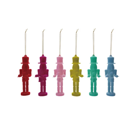 flocked, soldier shaped ornaments in six different colors on a white background