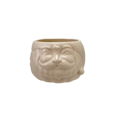 Ceramic pot shaped like a face with a beard on a white background