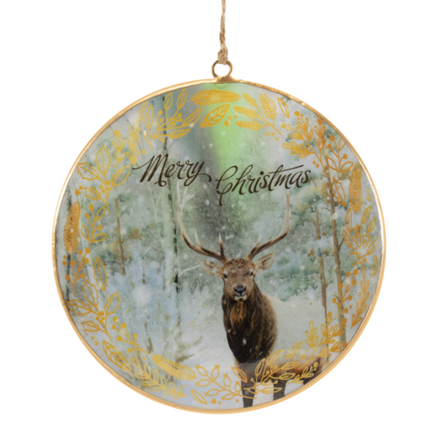 Decorative Christmas ornament with a deer in a forest scene and 'Merry Christmas' text.