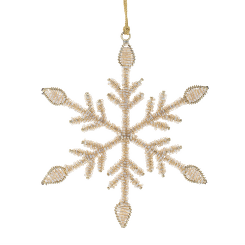 Decorative snowflake ornament with beaded details on a white background