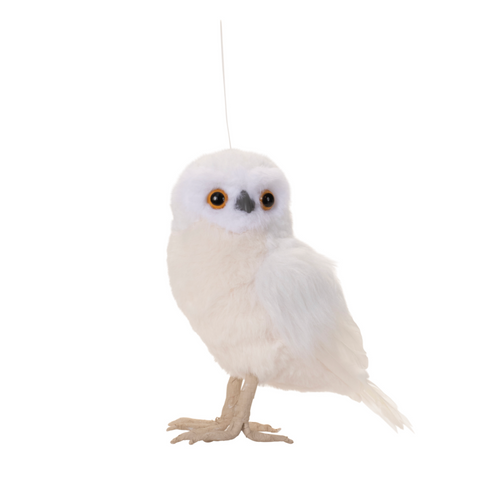 White owl figurine on a white background
