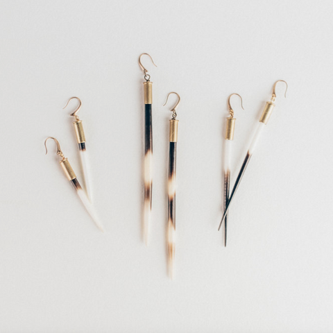 Set of earrings on a light gray background