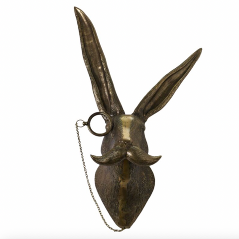 Decorative metal rabbit head with long ears on a white background