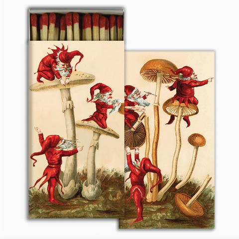 Matchbox with red gnomes and mushrooms design on a white background