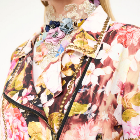 Floral patterned jacket worn by a person on a white background