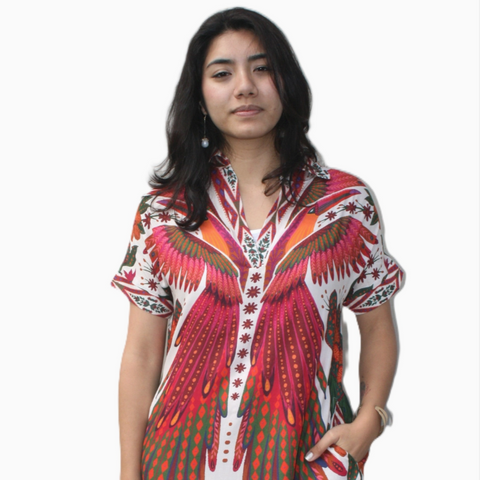 Woman wearing a colorful patterned dress on a white background