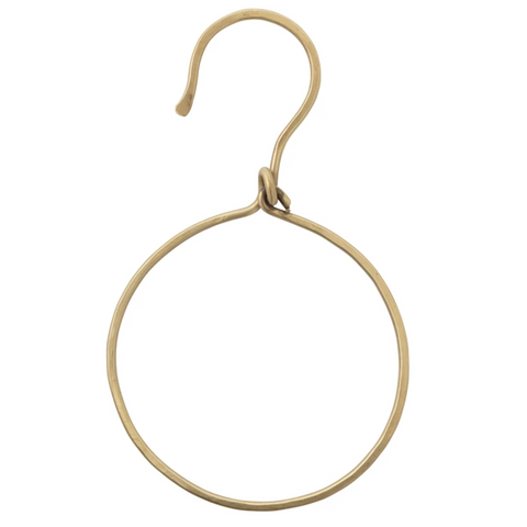 Gold hoop earring on a white background