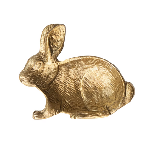 Gold rabbit figurine on a white background