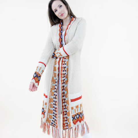 Woman wearing a long, patterned scarf with a white background