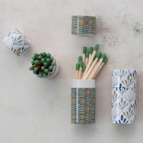 Matches in a patterned container on a light surface