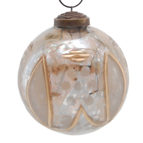 A clear glass hanging ornament with abstract metallic gold and bronze geometric patterns, suspended by a gold cord against a white background.